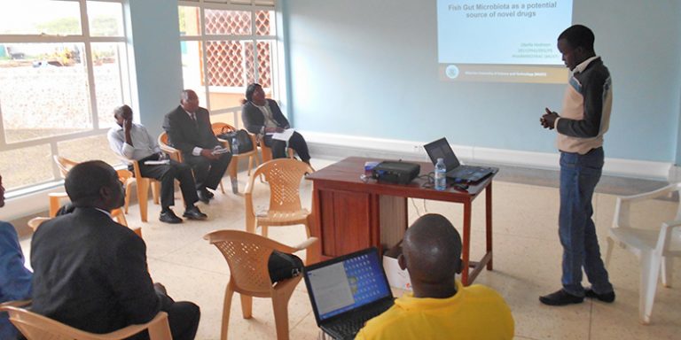 Mr. Hedmon Okella, PhD Student present his research proposal at the annual PHD symposium